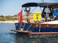 The aft of this motor cruiser is designed with comfort and ease in mind - a nice cockpit with swim platform and ladder down to the water.